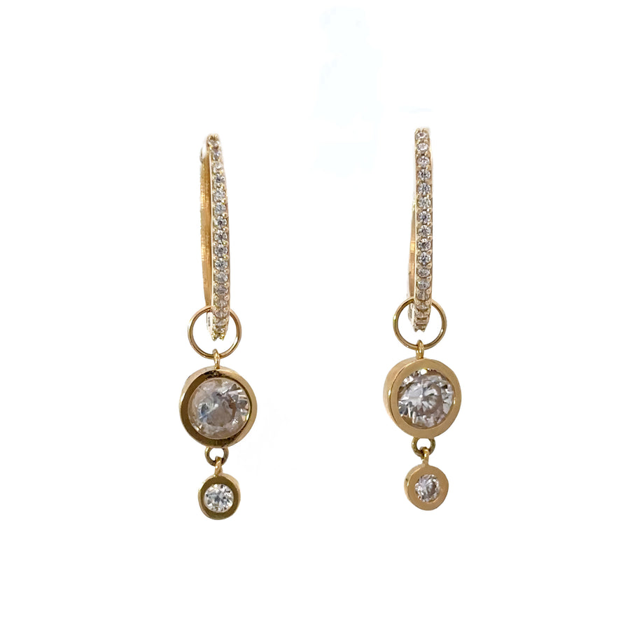 Close-up of simple 14k gold earrings with polished finish