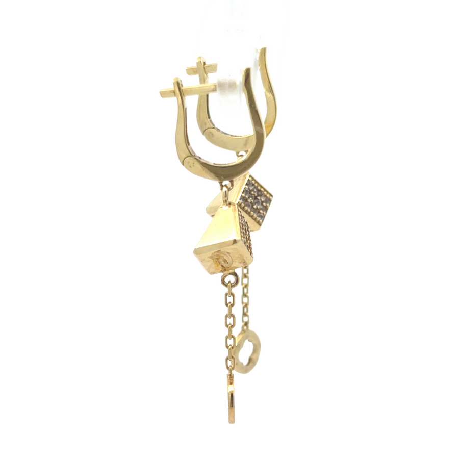 Elegant woman wearing 14k gold earrings, adding sophistication to her outfit