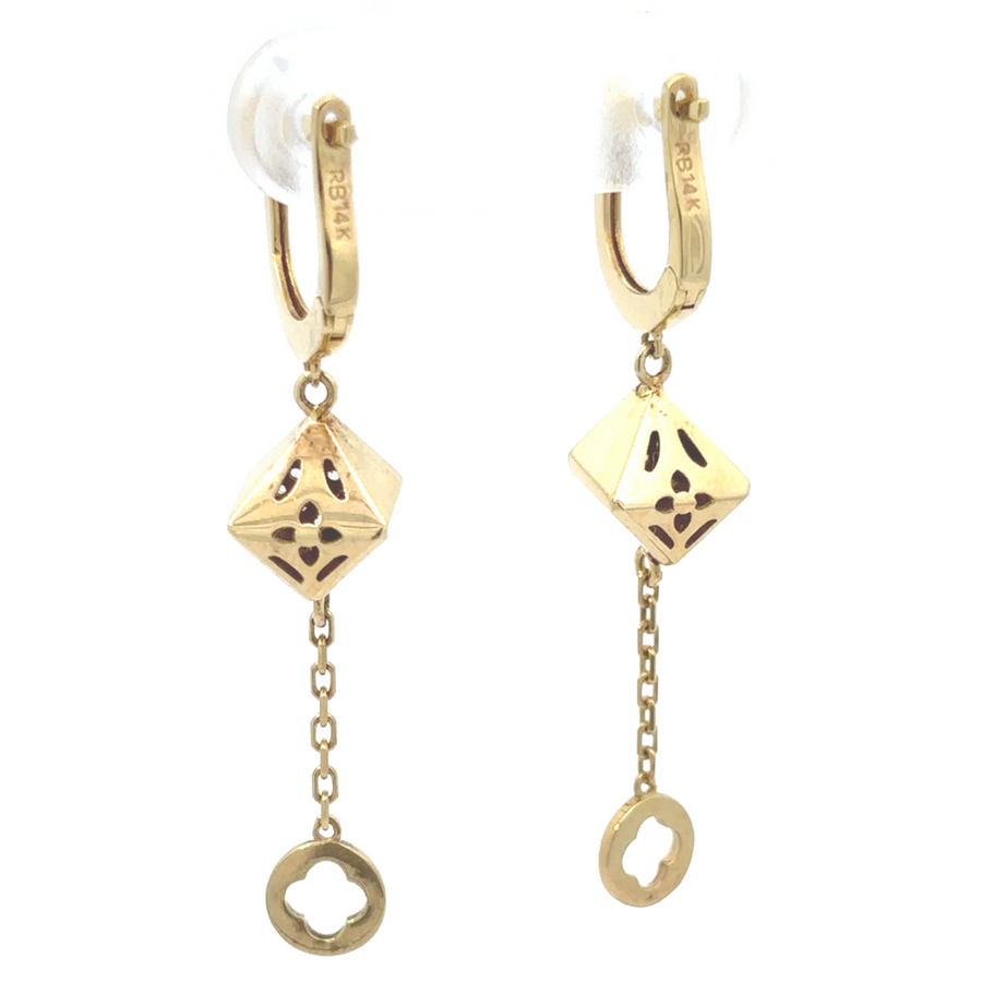 14k gold earrings laid flat on a soft, textured background for detailed view