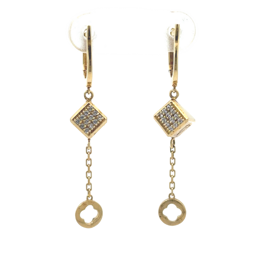 14k gold earrings displayed on a luxurious fabric backdrop