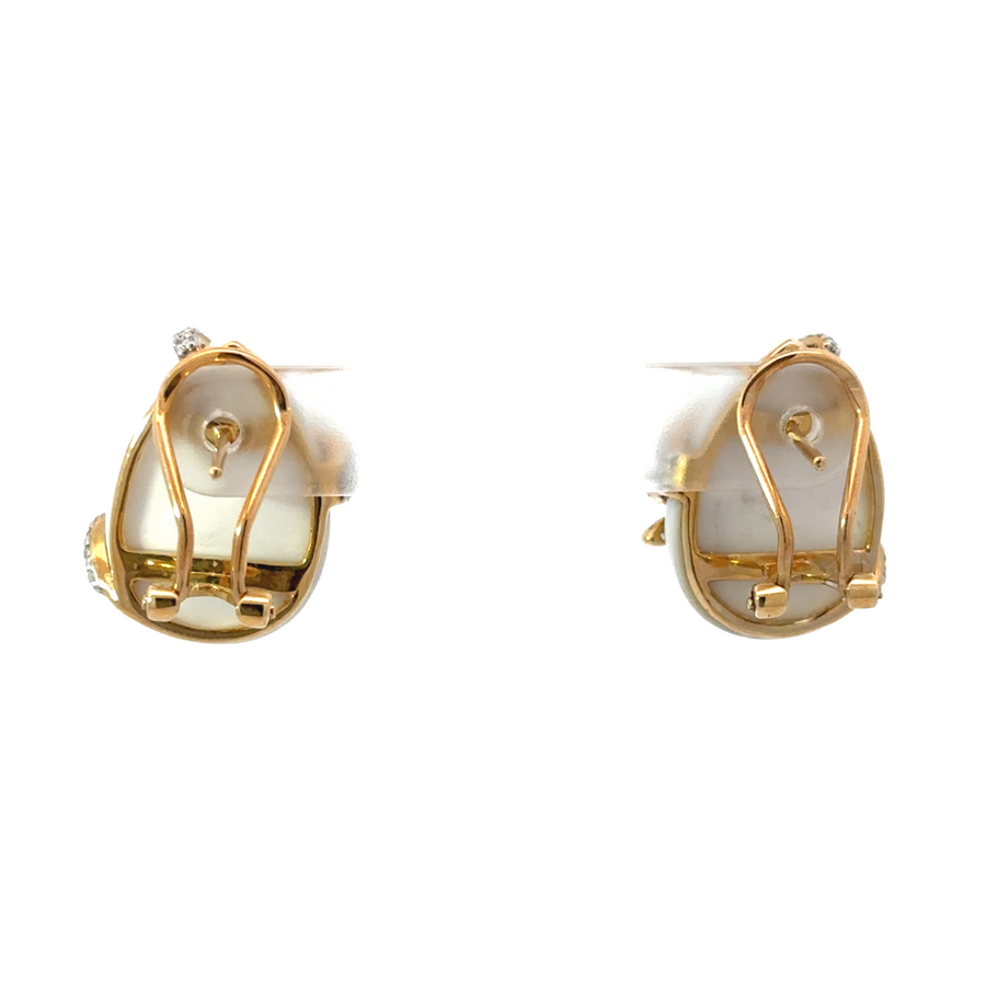 Side view of women’s diamond earrings in 14k gold