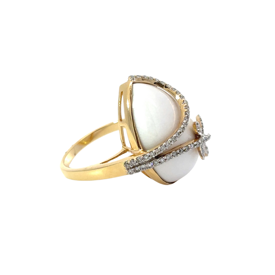 Side view of 14k gold diamond earrings on white background