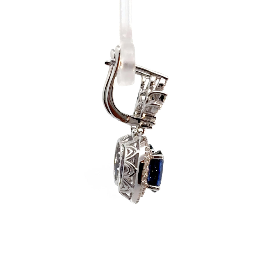 Women’s diamond and sapphire earrings in 14k gold setting