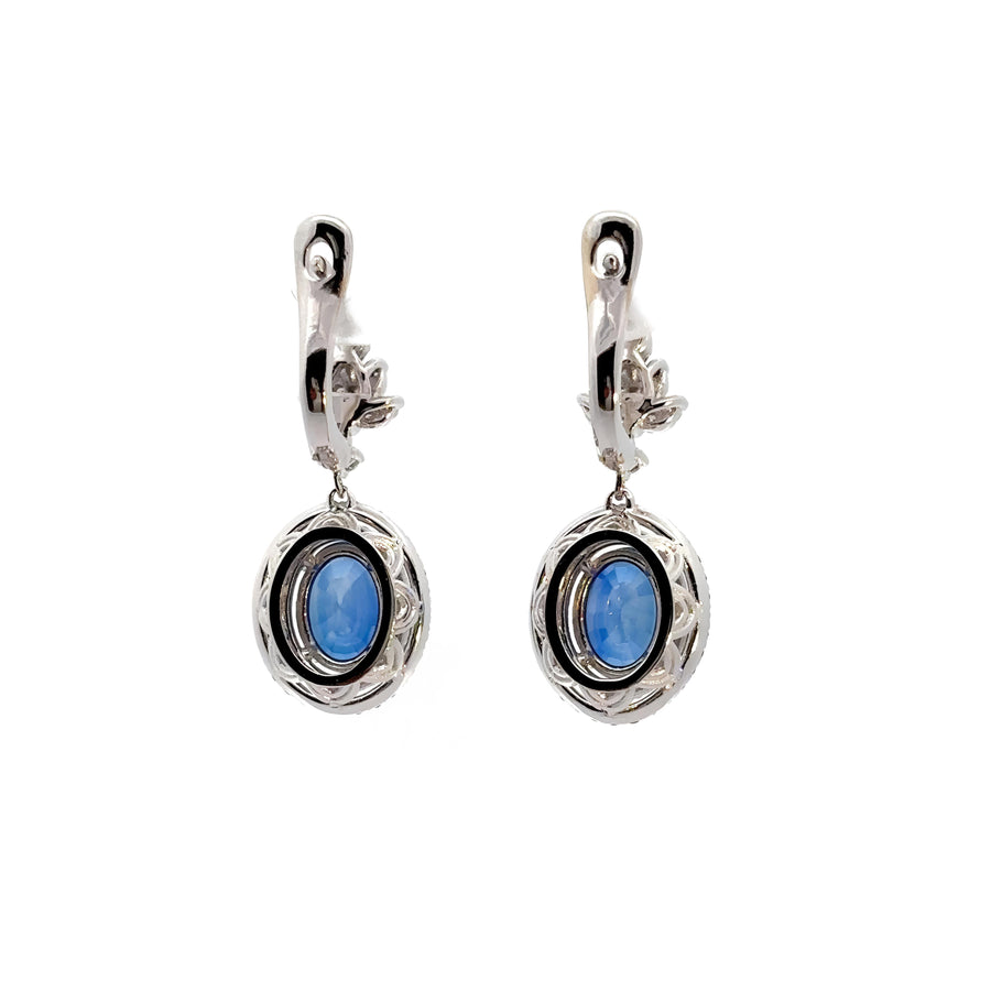 Pair of 14k gold earrings with blue sapphire and diamond accents