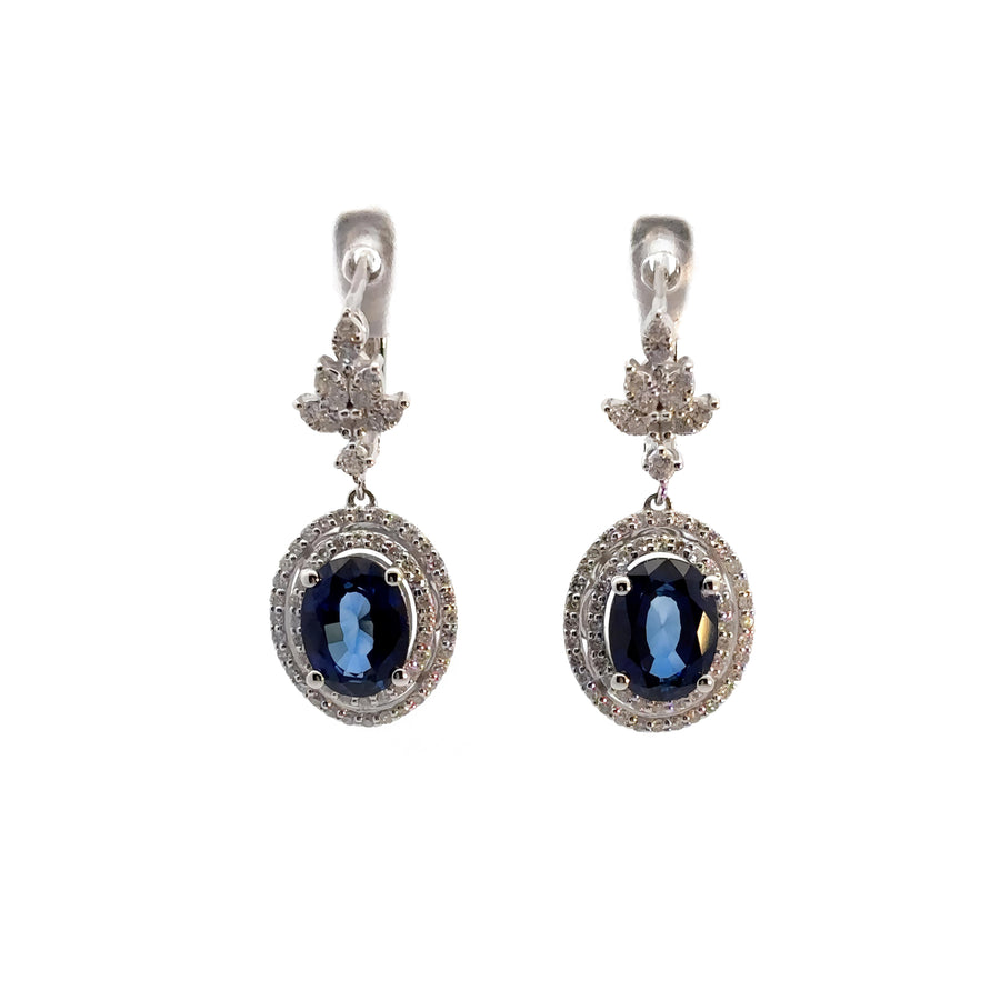 Elegant 14k gold earrings featuring sparkling diamonds and deep blue sapphire
