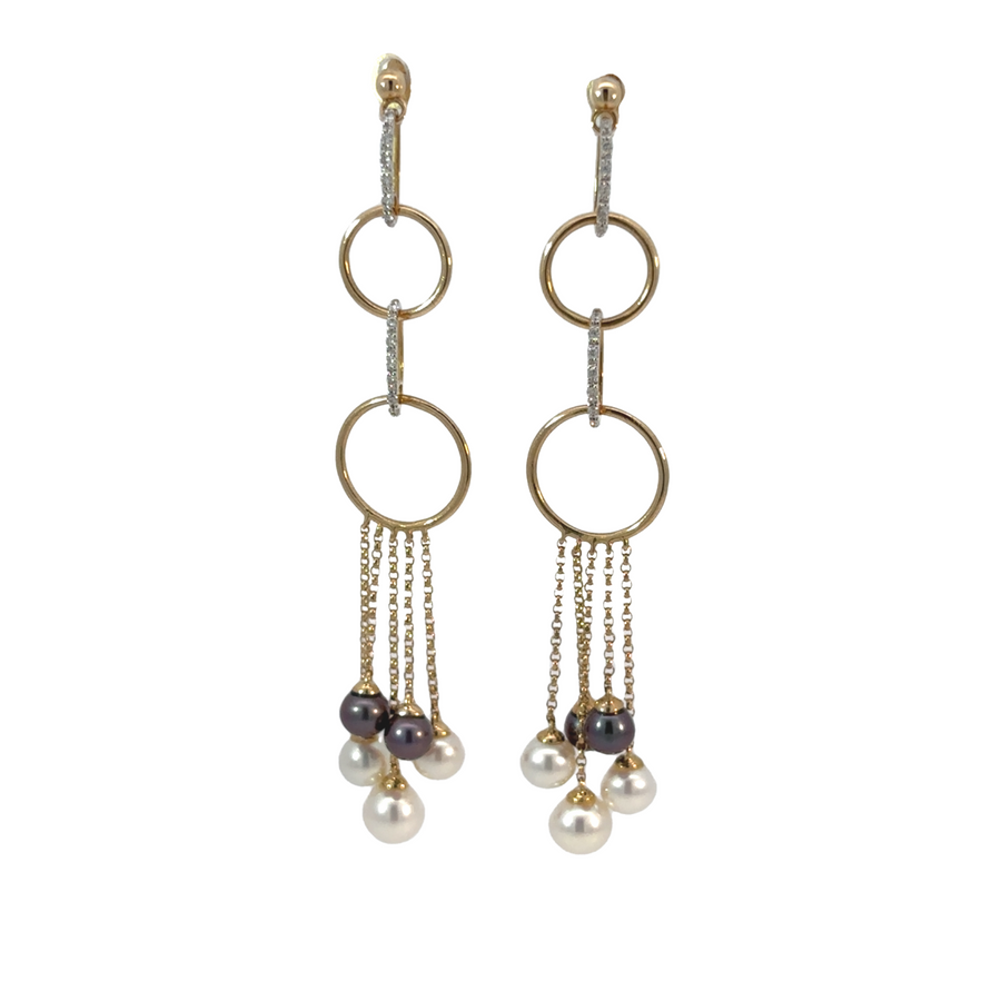14k gold earrings with sparkling diamonds and lustrous pearls close-up