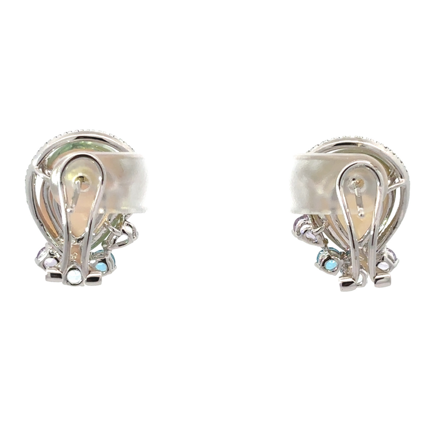 Classic gold earrings with diamonds on display