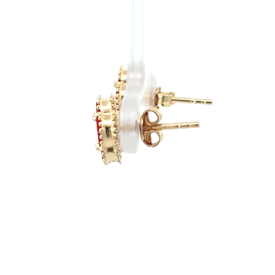 Model wearing red-accented 14k gold earrings with updo hairstyle