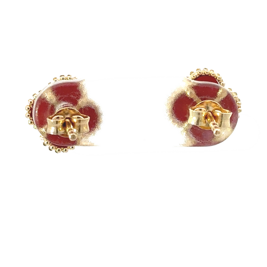 Macro view showing intricate craftsmanship of gold and red setting