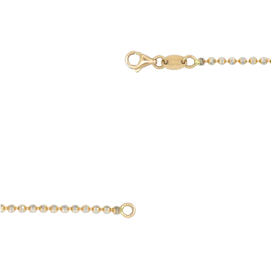 Two-tone gold chain laid flat showing faceted details