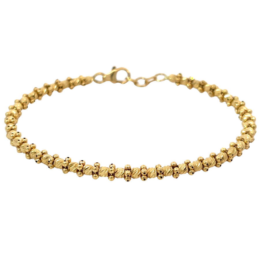 Intricately detailed 14k gold fancy bangle bracelet for women