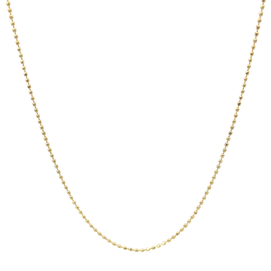 Close-up of intricate gold fancy links showing texture and shine