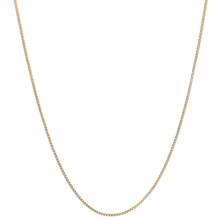 Close-up of 14k gold slim-link chain on white background