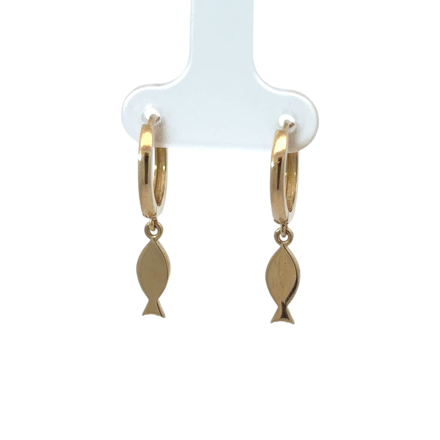 Detailed view of fish-shaped 14k gold huggie earrings