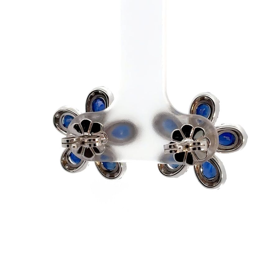 Side profile of 14k gold flower earrings showing sparkling stones