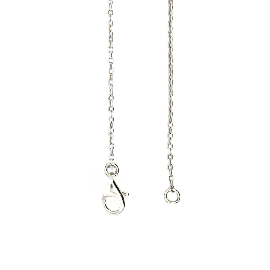 Front view of diamond and sapphire floral pendant on 17-inch gold chain