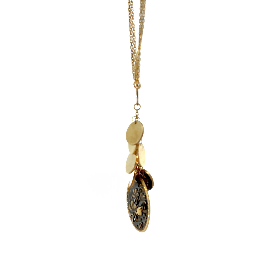 Flat lay of 14k gold necklace showing adjustable chain clasp