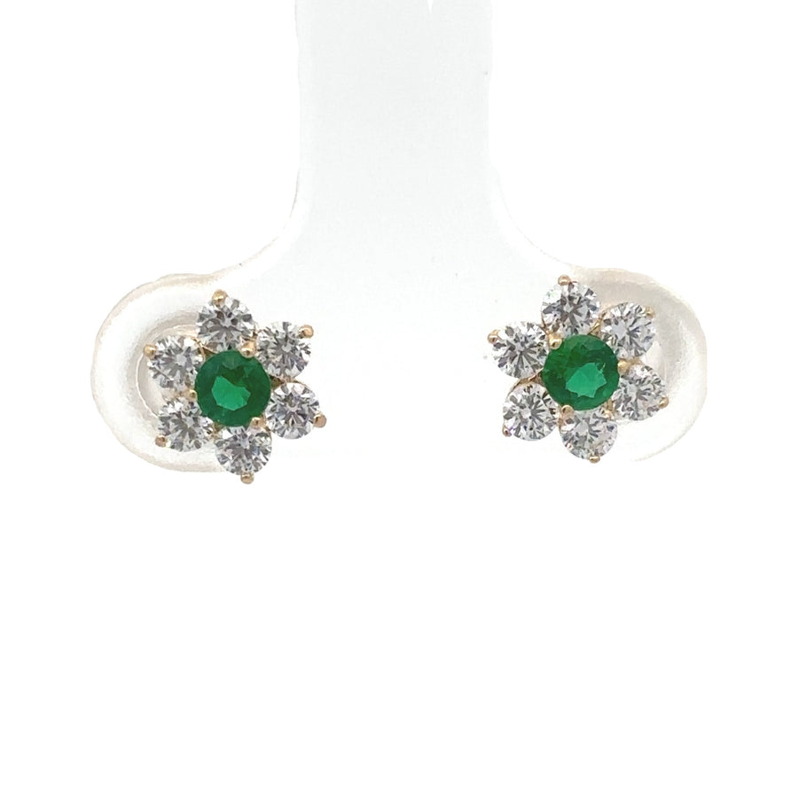 14k gold flower stud earrings on white background
