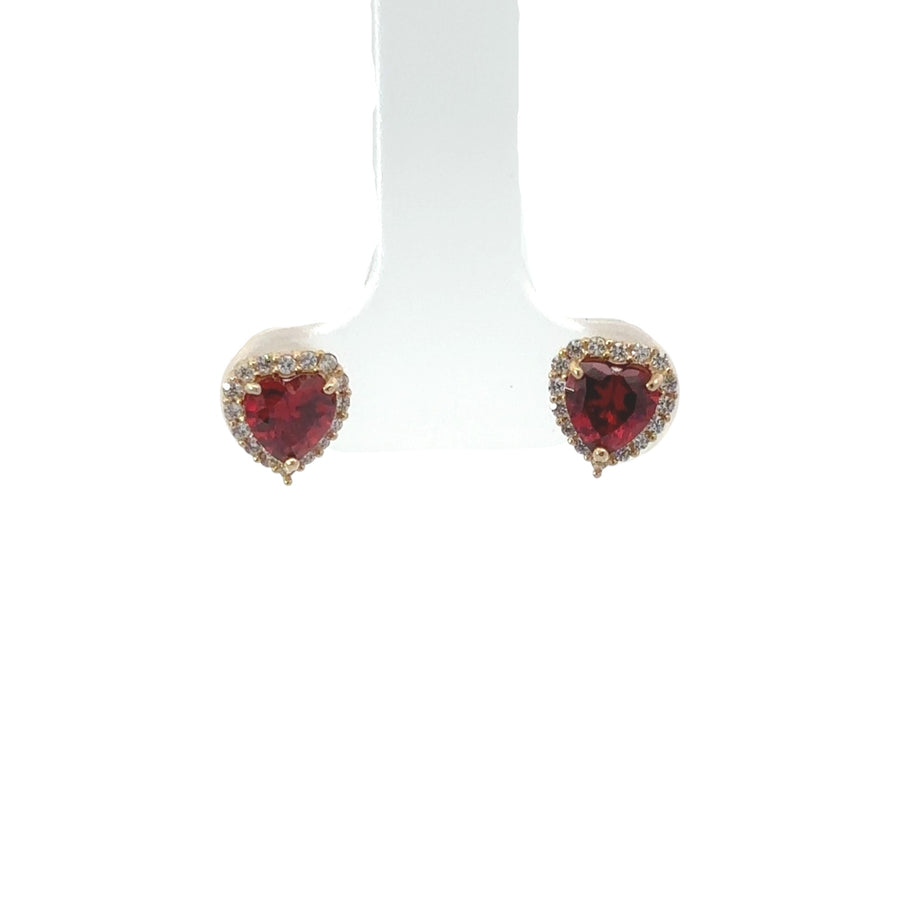 Close-up of 14k gold heart-shaped stud earrings with cubic zirconia