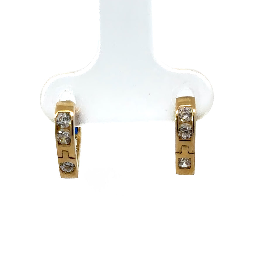 Sparkling cubic zirconia on small gold heart earrings for babies