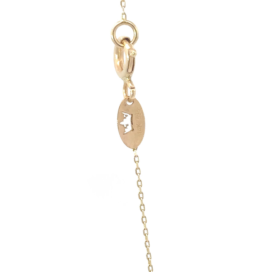 Gold necklace laid flat with adjustable clasp visible