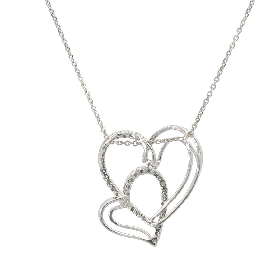 Close-up of diamond-studded heart on gold chain