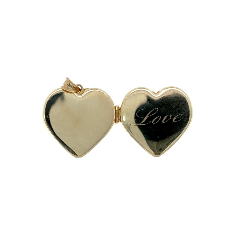 Close-up of polished gold heart pendant