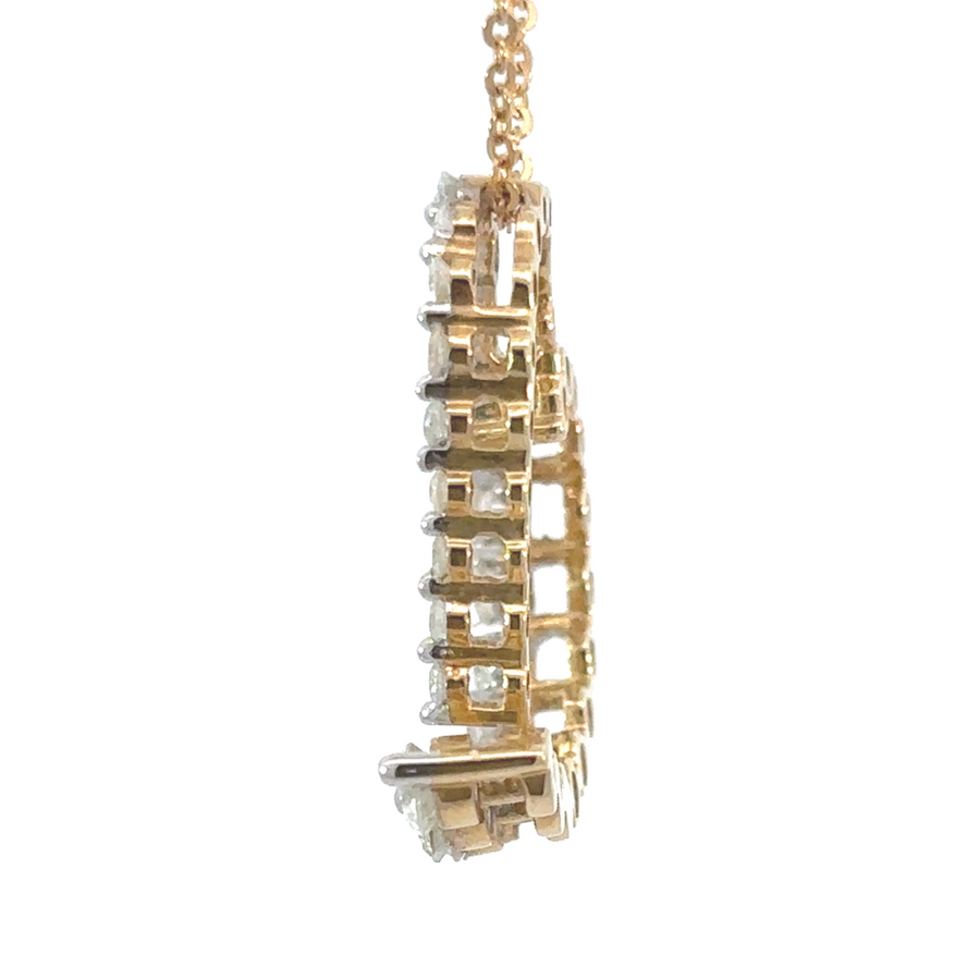 Elegant 14k gold heart pendant featuring sparkling diamonds