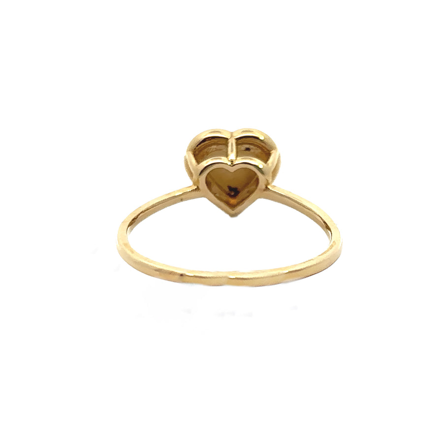 Side view of heart-shaped 14k gold ring with diamond