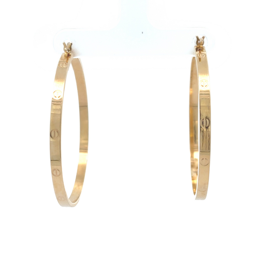 Statement 14k gold earrings styled with formal attire