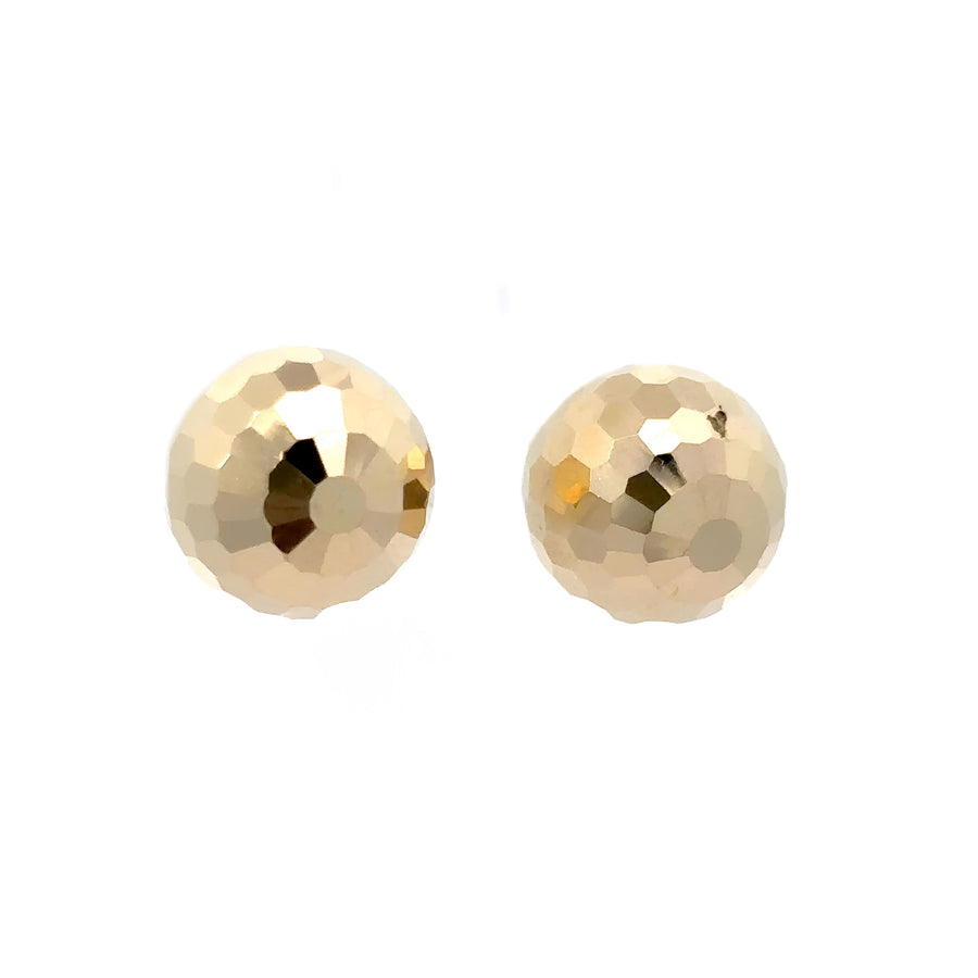 Pair of 14k gold hoop earrings on white background