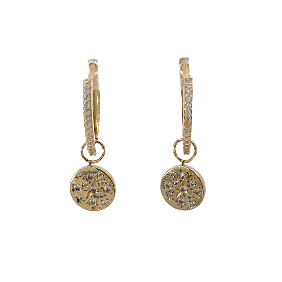 Modern gold huggies featuring dangling circle design