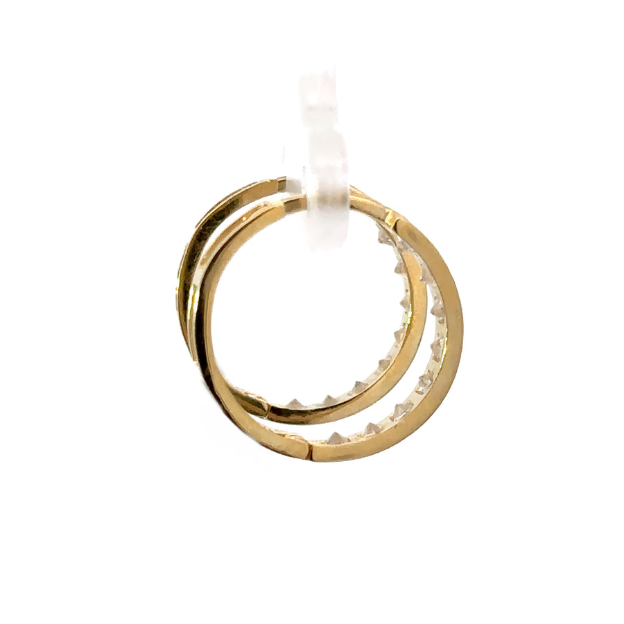 Detail shot of CZ stones set in 14k gold hoop