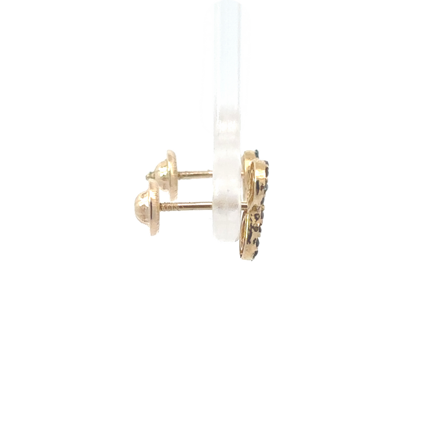 Close-up of infinity-shaped 14k gold earrings