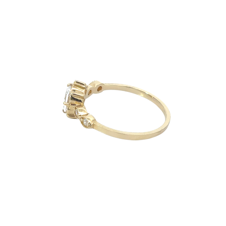 Close-up of oval center stone in the 14k gold ring, showcasing its brilliant shine and timeless elegance.