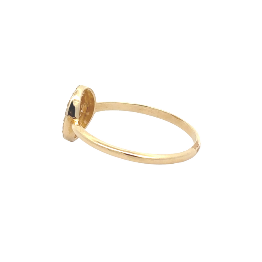 Solo ring positioned upright on a marble surface