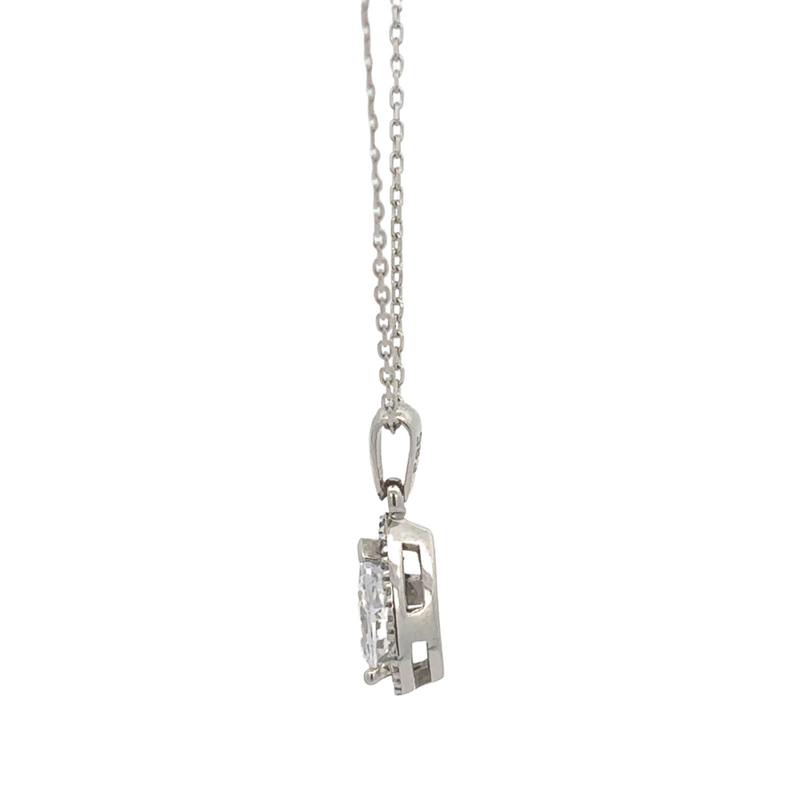Close-up of drop earrings with cubic zirconia in gold