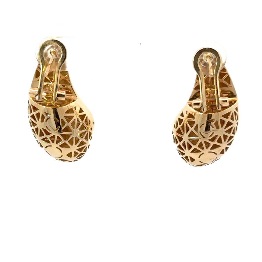 Detailed shot of the 14k gold drop earrings, showcasing the fine craftsmanship and radiant shine.