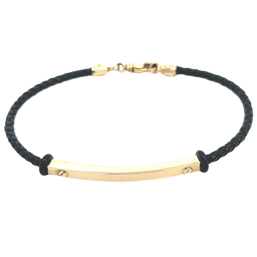 Close-up of 14k gold and leather men's bracelet showcasing luxurious gold accents