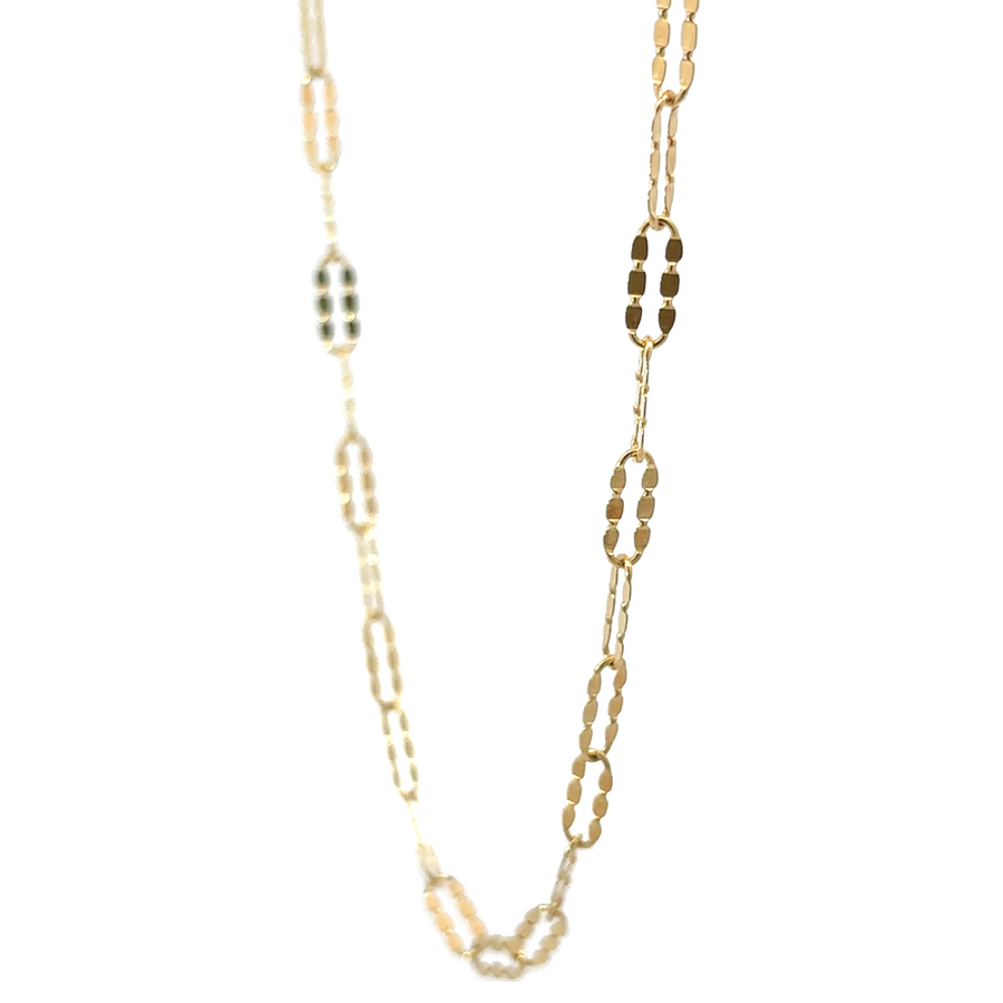 Side view of 14k gold long shine chain highlighting its elongated design