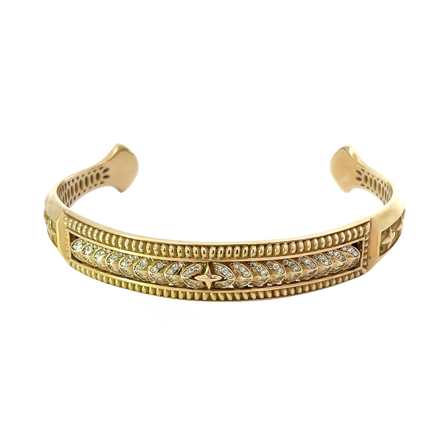 Close-up of diamonds on 14k gold men’s open bangle