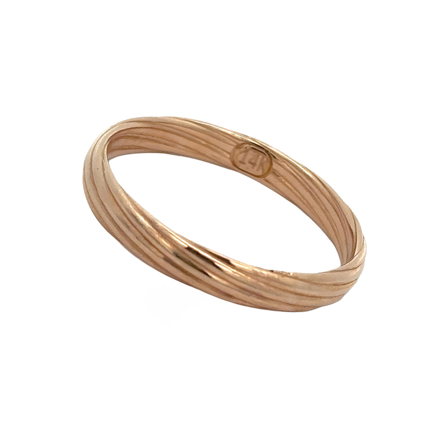 Close-up of 14k gold twist texture on men’s band