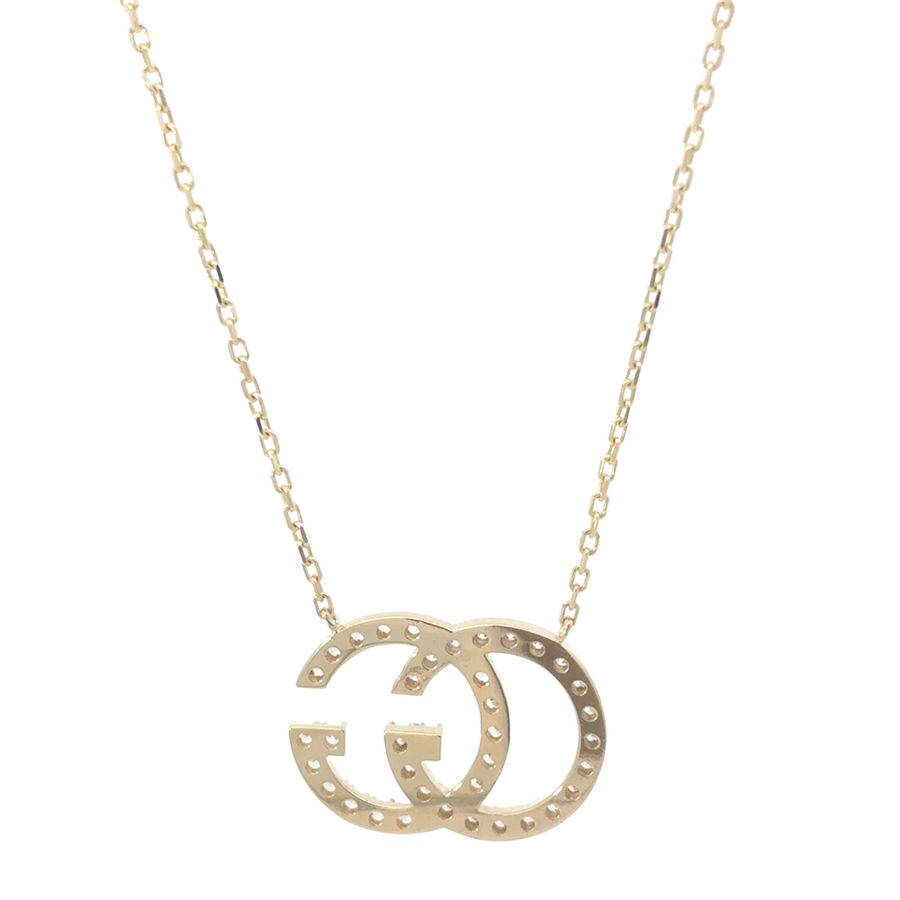 Close-up of adjustable 14k gold necklace link and clasp mechanism