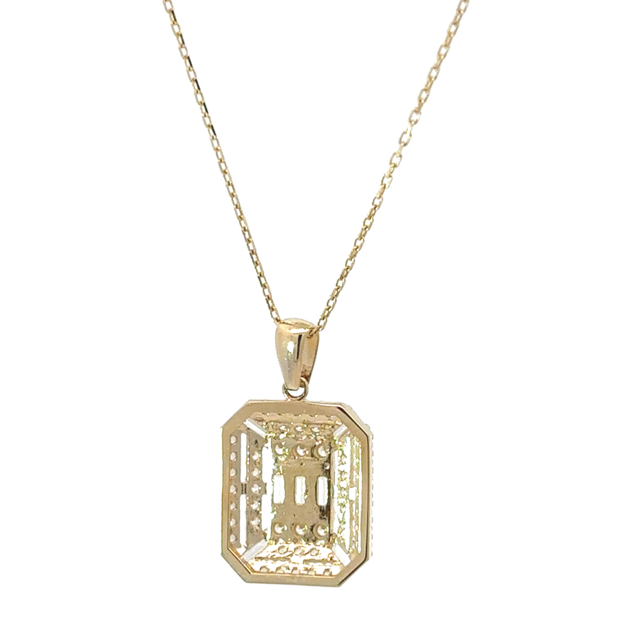 Woman wearing 14k gold necklace styled with a V-neck top