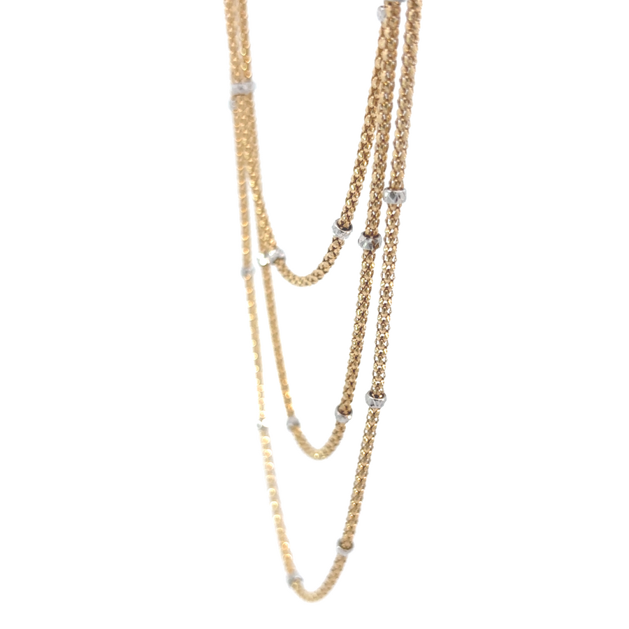 Three-tier necklace laid flat, showing 16", 20", and 23" chain levels