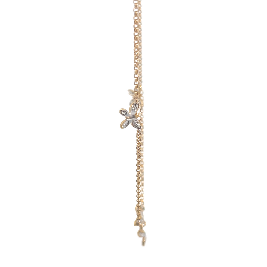 Close-up of butterfly charm on 14k gold bracelet