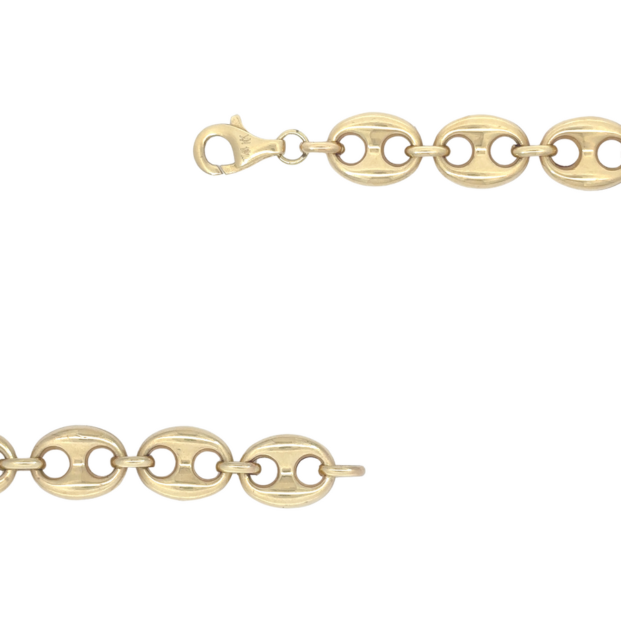 Detailed shot of a 14k gold necklace for men with a smooth, refined design