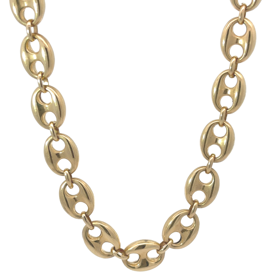 Close-up of 14k gold men's necklace showcasing its sleek high-polish finish