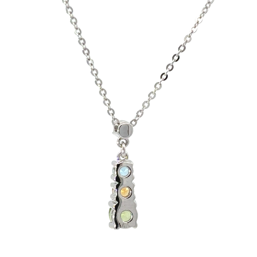 Necklace displayed on velvet background highlighting topaz sparkle