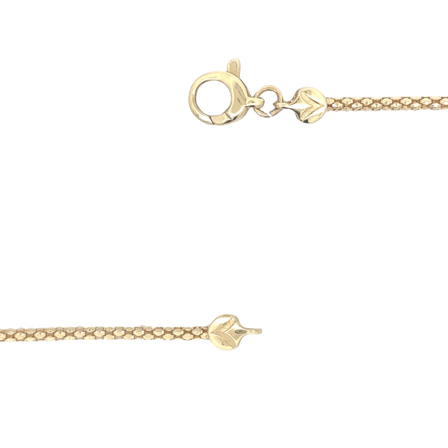 Two-tone gold necklace with 15 white gold balls, perfect for layering